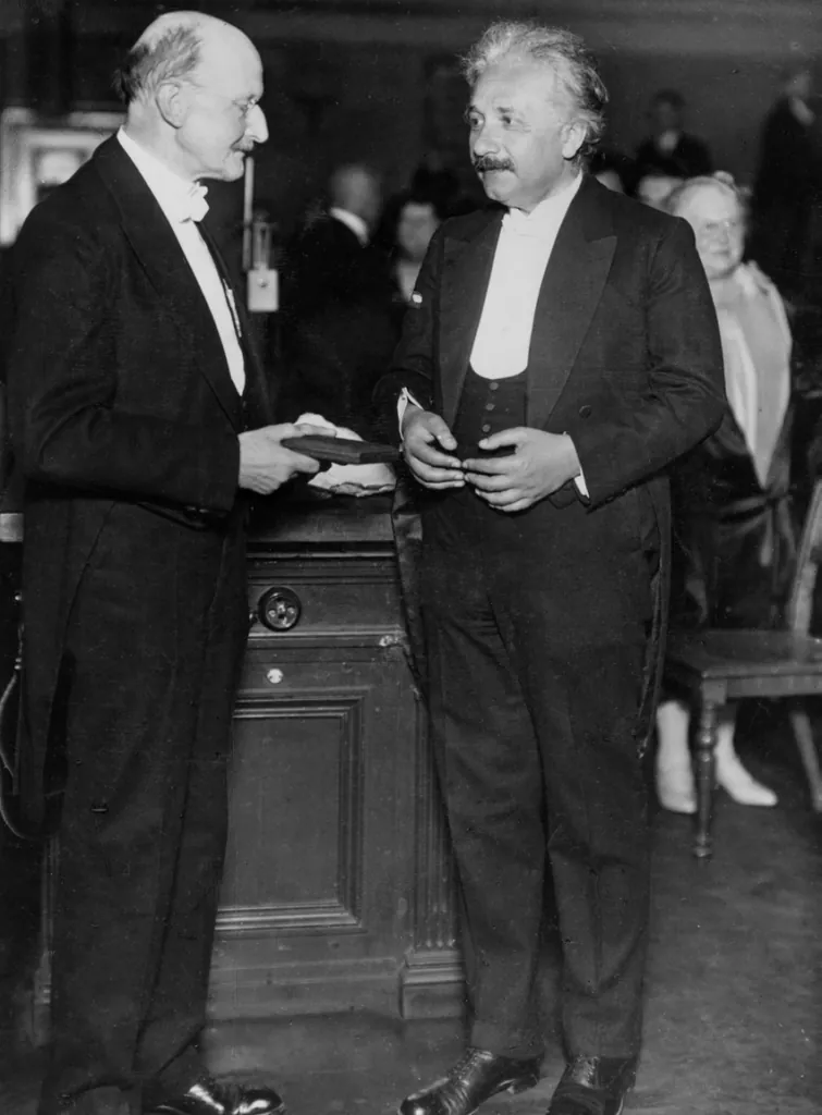Pioneers of quantum optics: Max Planck and Albert Einstein in 1929. Einstein receives the Planck Medal.